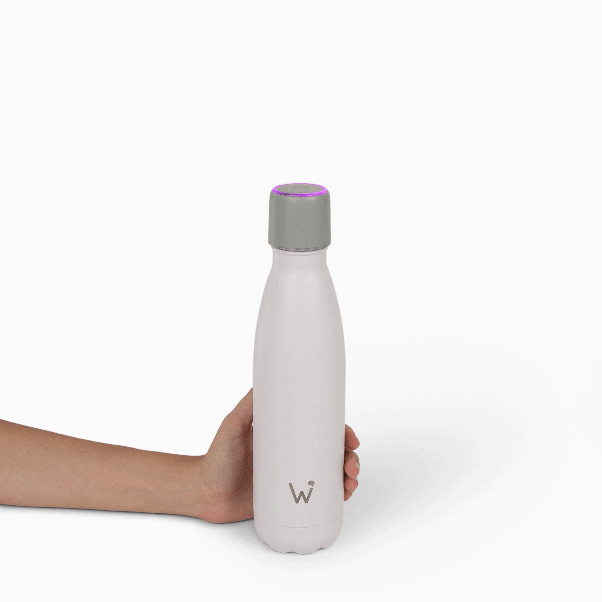 Woman taking cap off of Water.io bottle after receiving an LED smart cap notification.