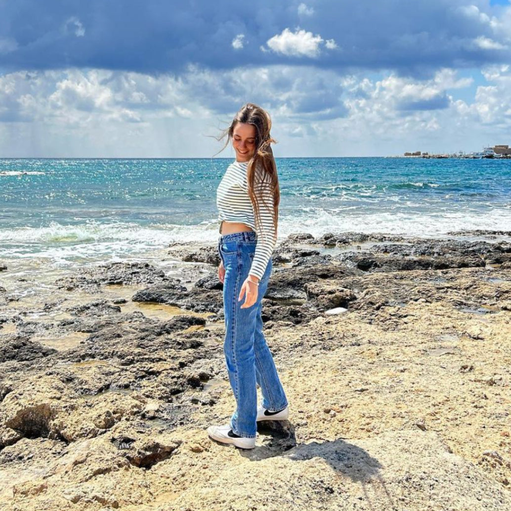 Founders daughter, Hila, posing near the ocean