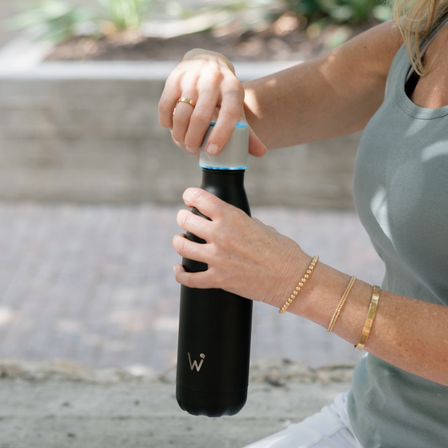 Woman taking off smart cap after getting an LED smart cap notification