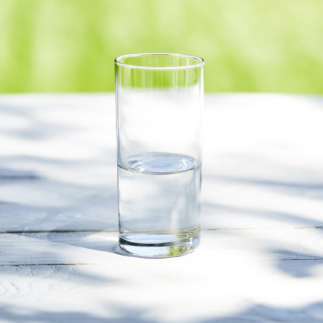 Glass of water sitting on table