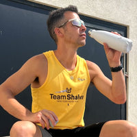 Man outside, drinking from Water.io bottle