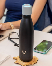 17oz Black Water.io bottle sitting on desk